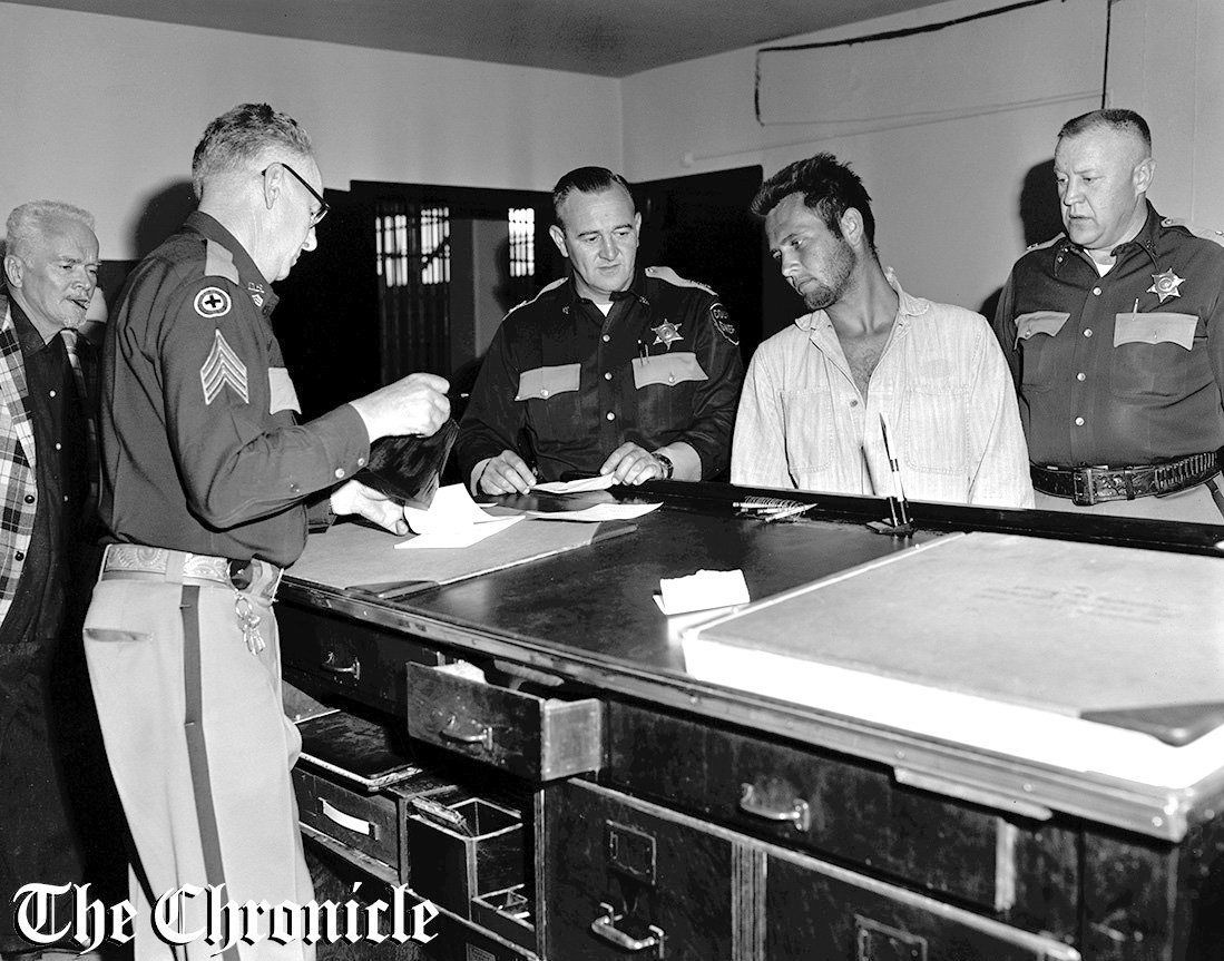 From the June 1959 Chronicle archives: “FACES FEDERAL ACTION - U.S. postal inspectors in Chehalis Wednesday identified Martin F. Englander, right, as one of the most wanted post office burglars and money order forgers in the nation. Most of his activities have been on the East coast. At left is Lewis County Sheriff Orville Amondson, who arrested Englander early this week near Vader where he had been working on a farm and picking berries.- Chronicle Staff Photo.”